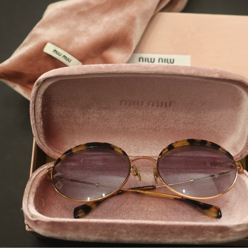 Miu Miu Tortoise Shell Sunglasses with Purple Lenses